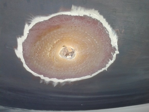 Exterior hull ground down to slope in towards the hole.